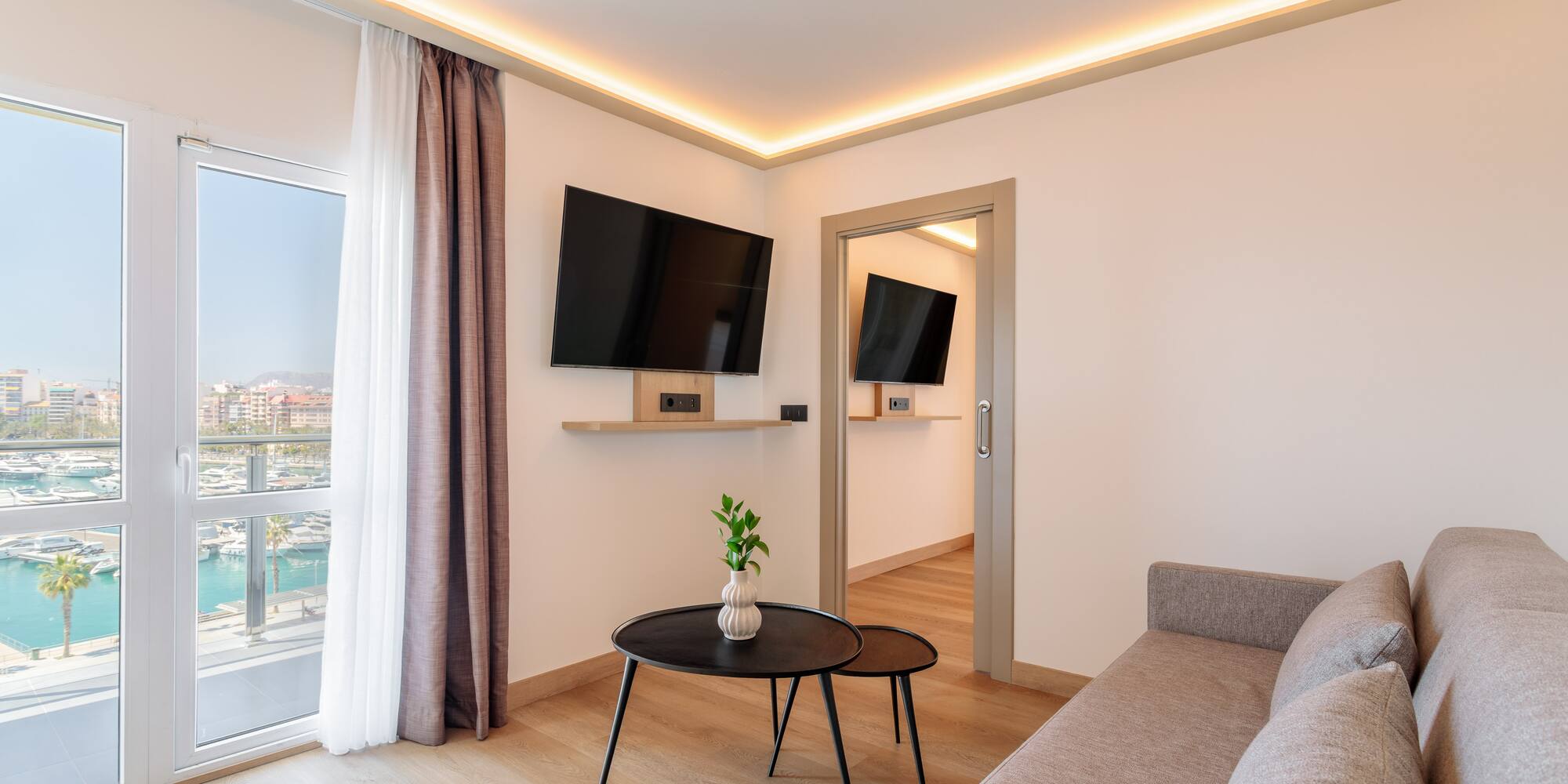 a living room with a couch and tv