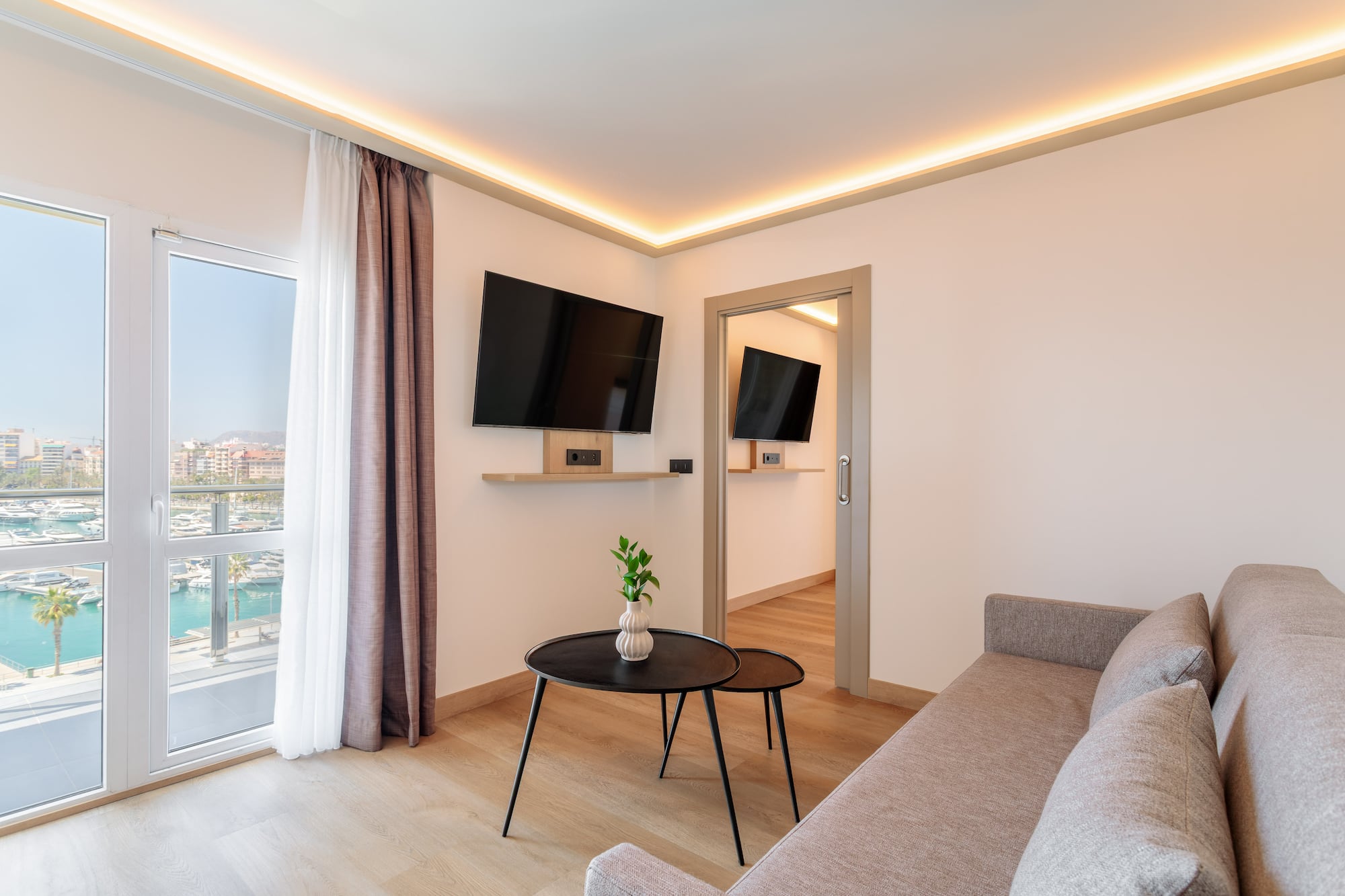 a living room with a couch and tv