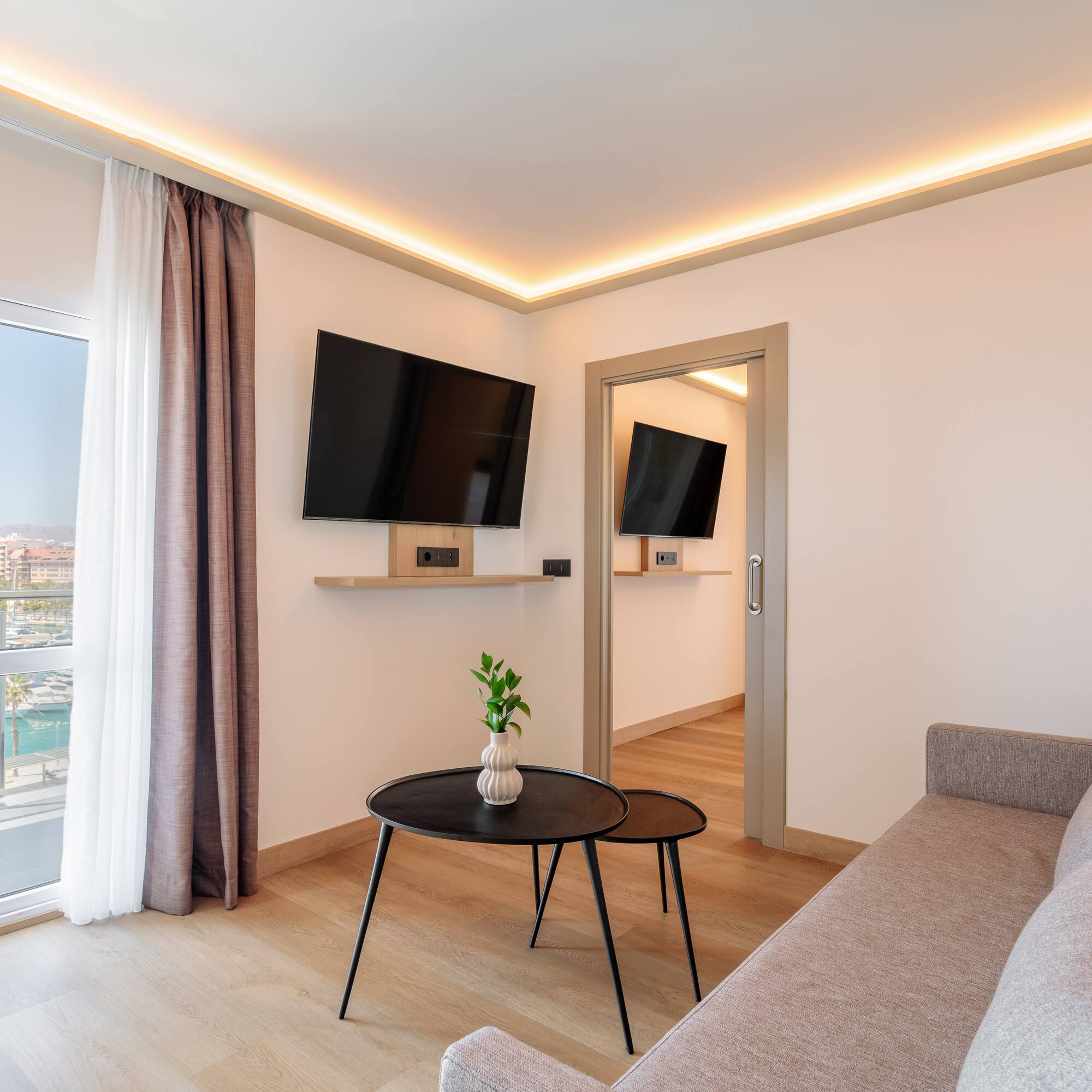 a living room with a couch and tv