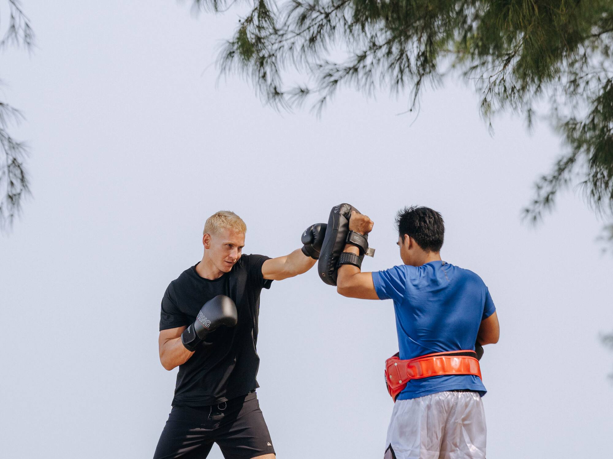 two men boxing on a beach