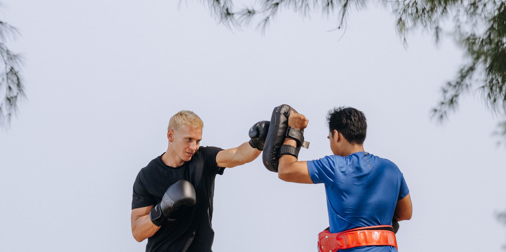 two men boxing on a beach