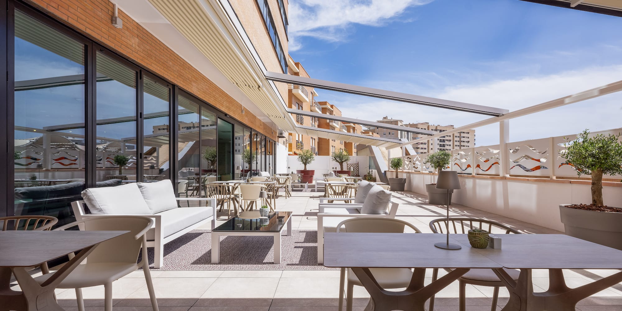 a patio with tables and chairs
