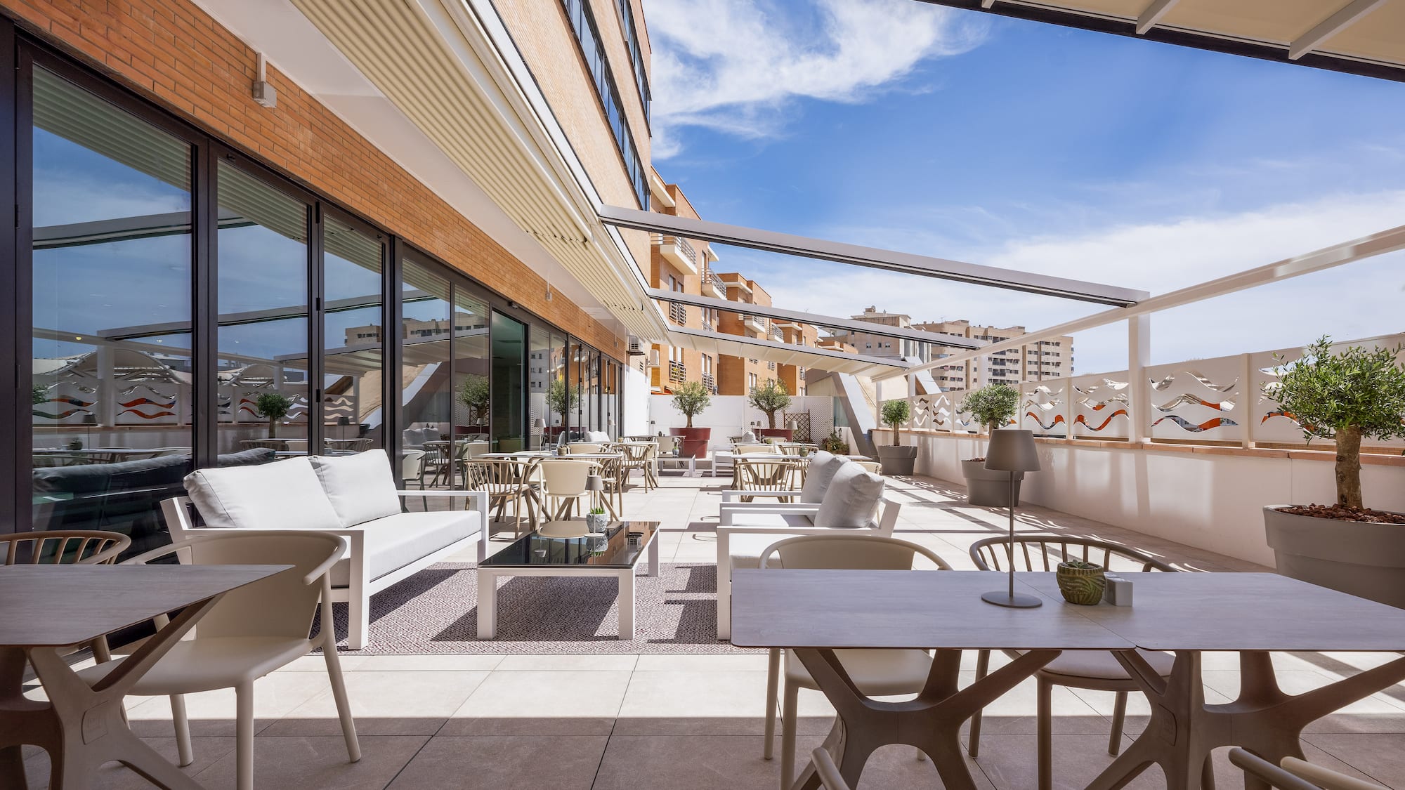 a patio with tables and chairs