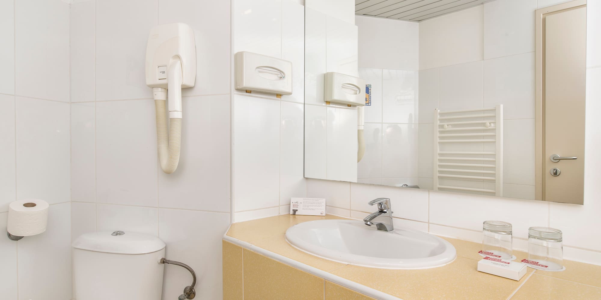 a bathroom with a sink and toilet