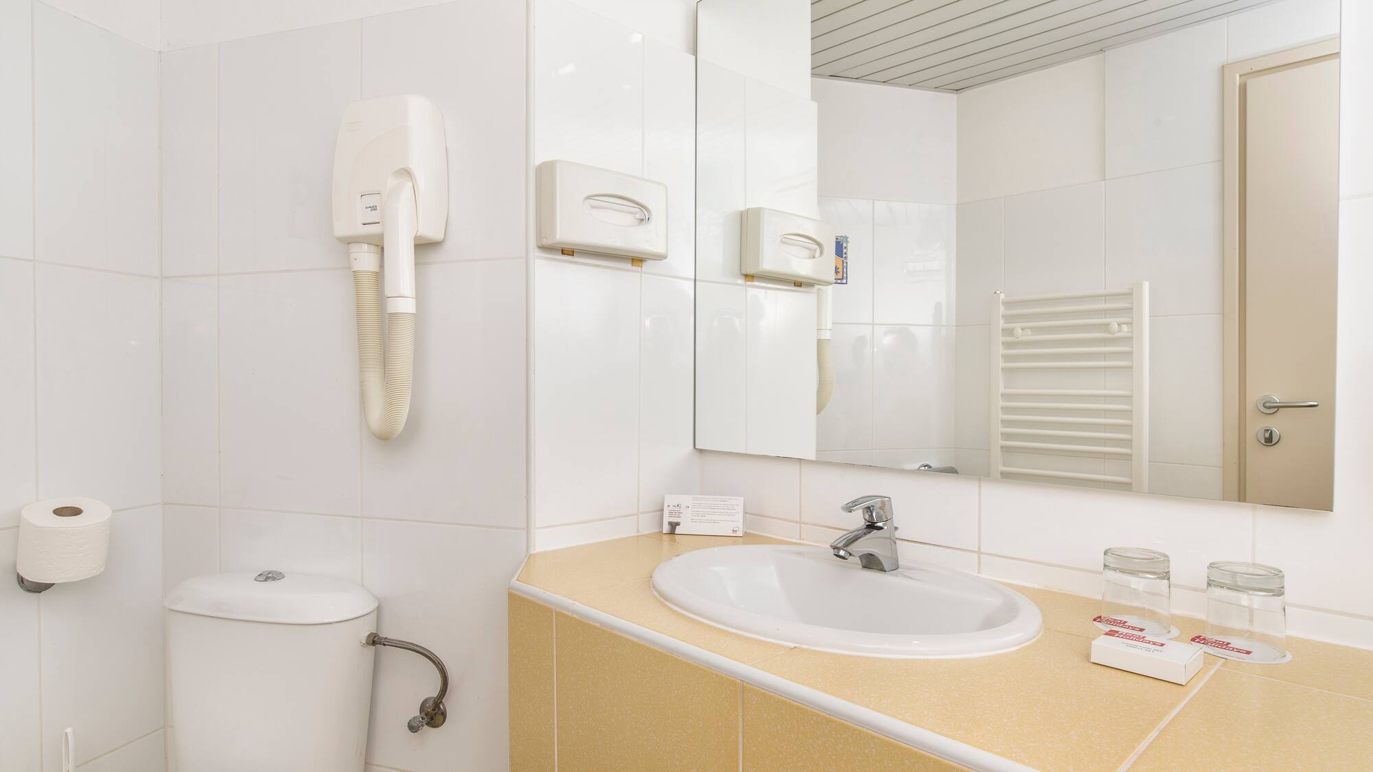 a bathroom with a sink and toilet