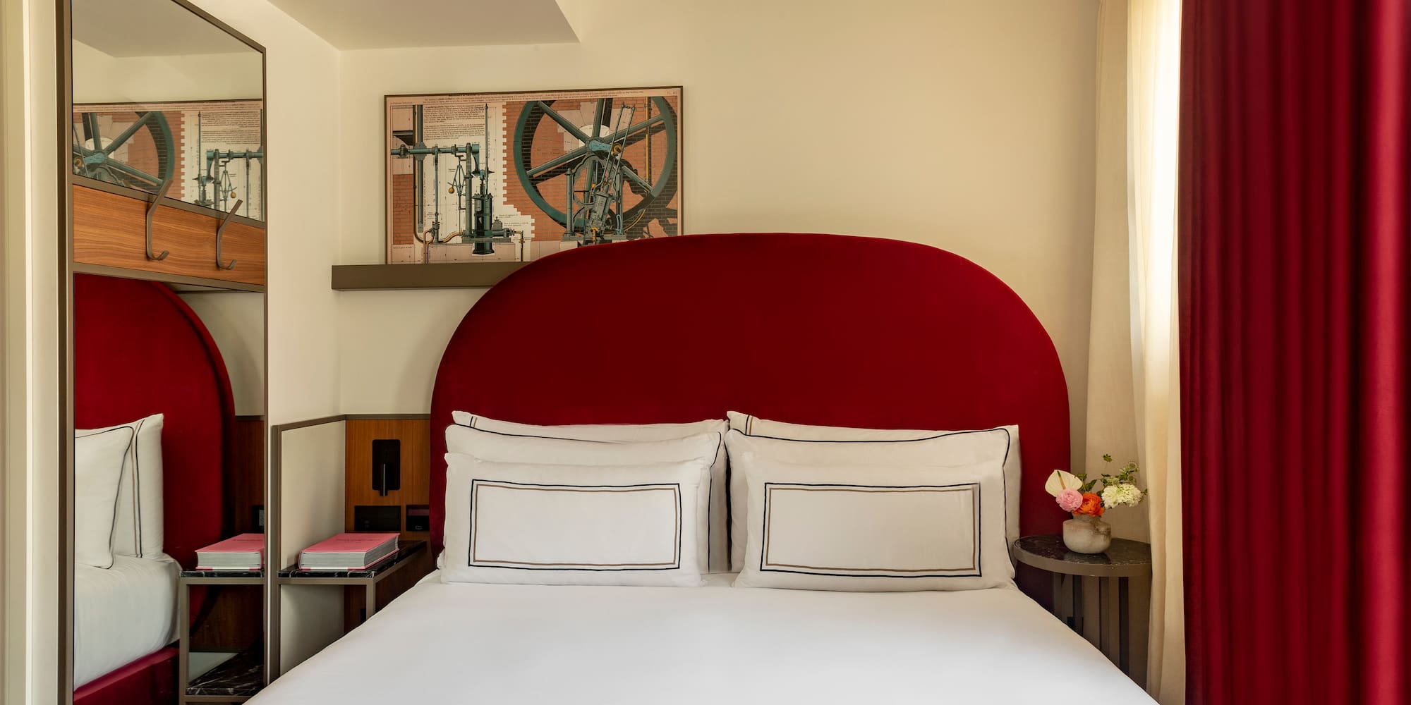 a bed with a red headboard
