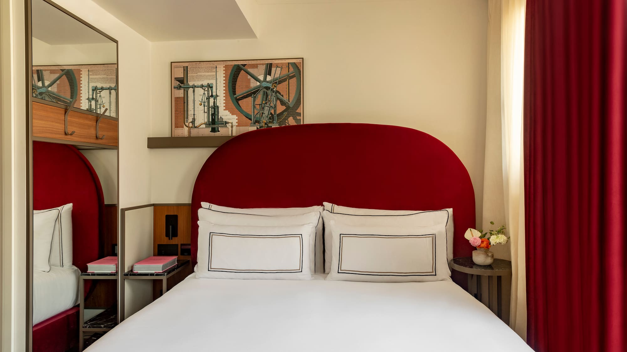 a bed with a red headboard