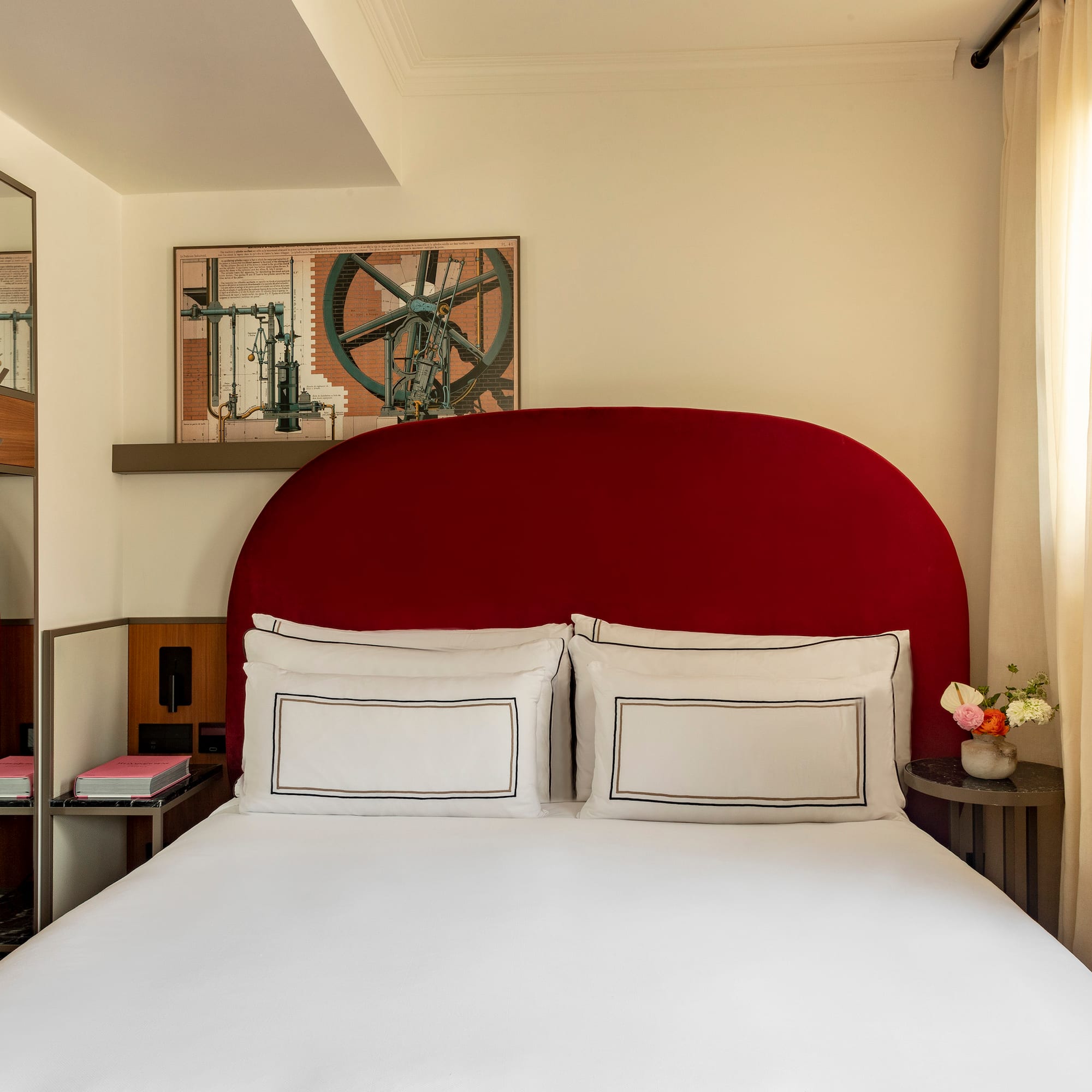 a bed with a red headboard