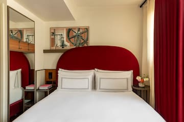 a bed with a red headboard