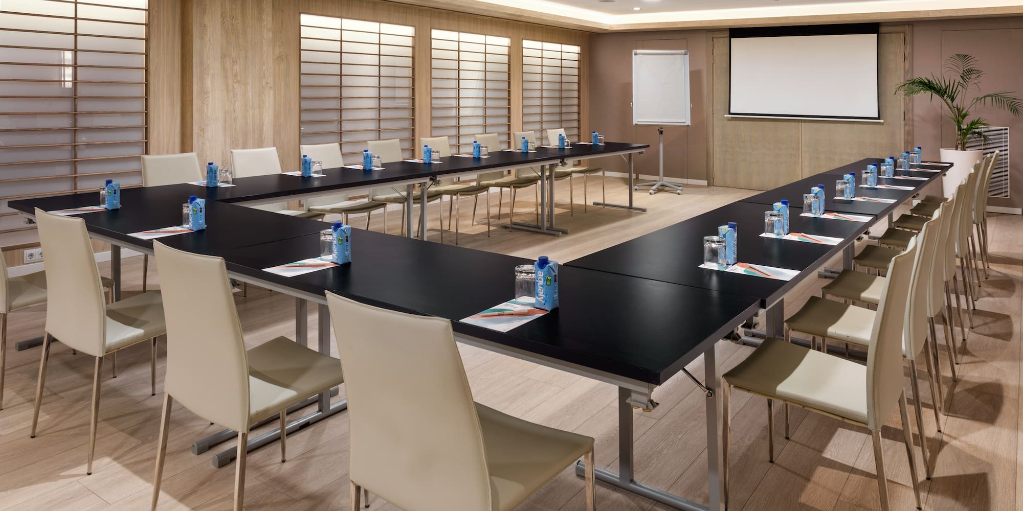 a room with a large table and chairs