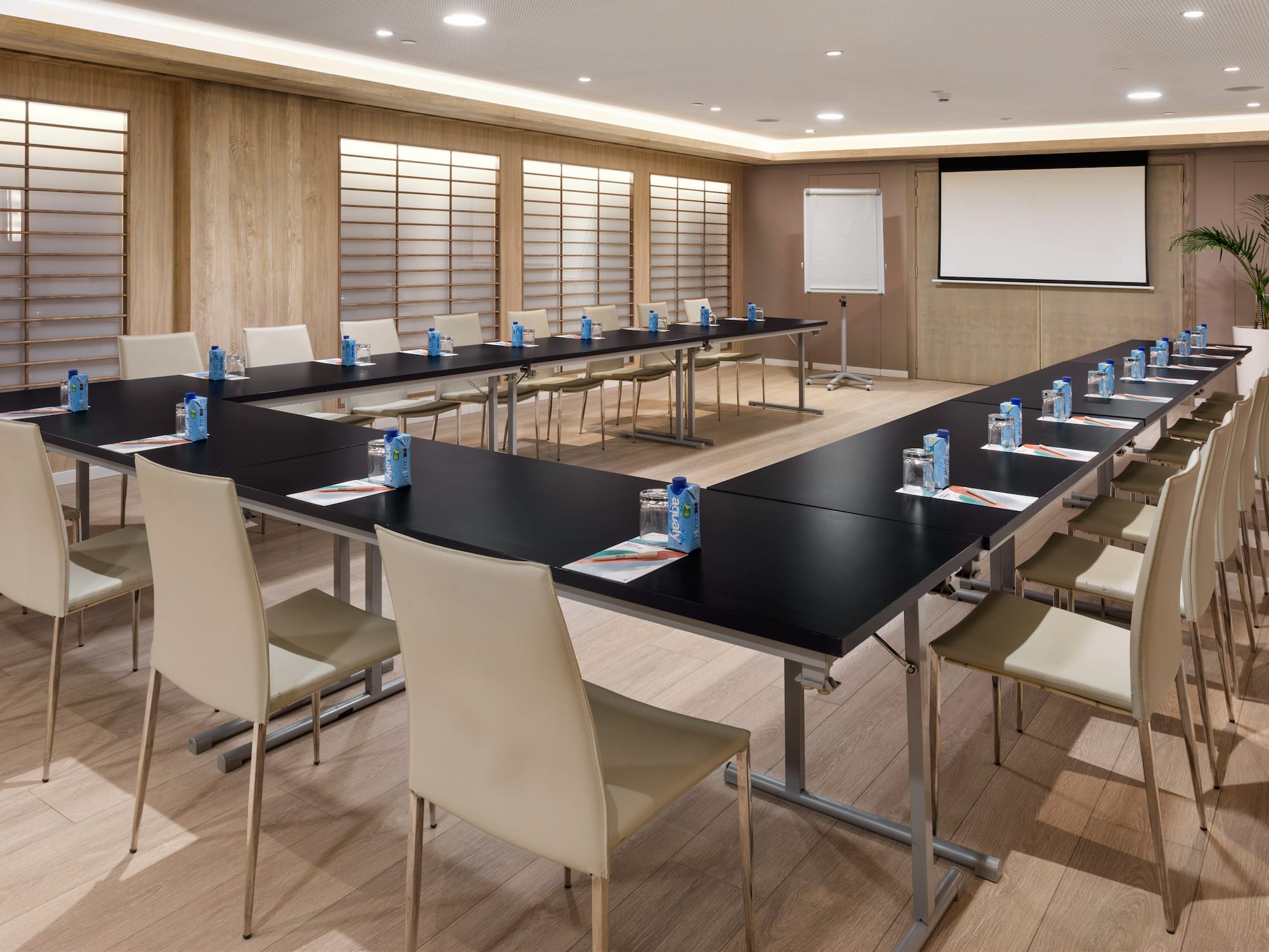 a room with a large table and chairs