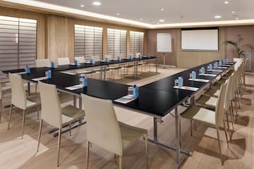 a room with a large table and chairs