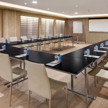 a room with a large table and chairs