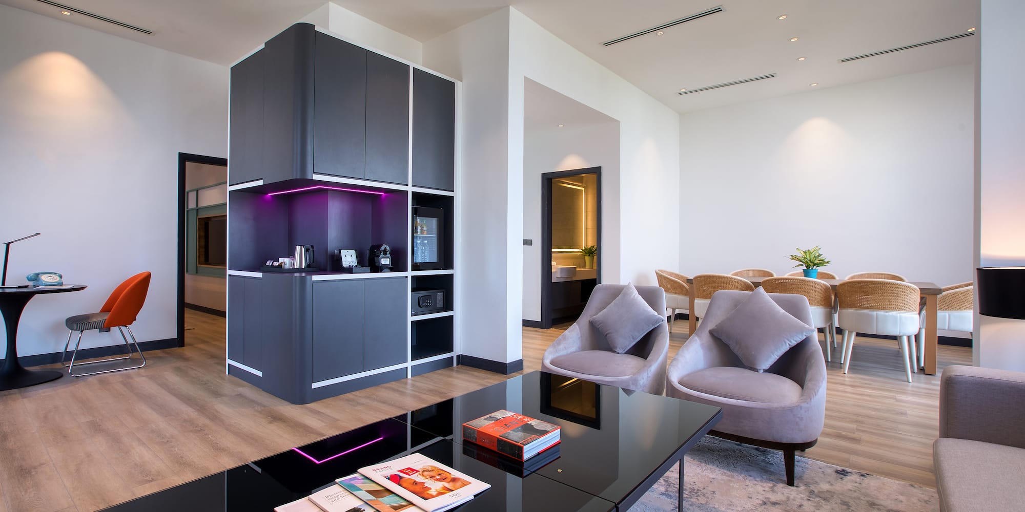 a room with a black table and chairs