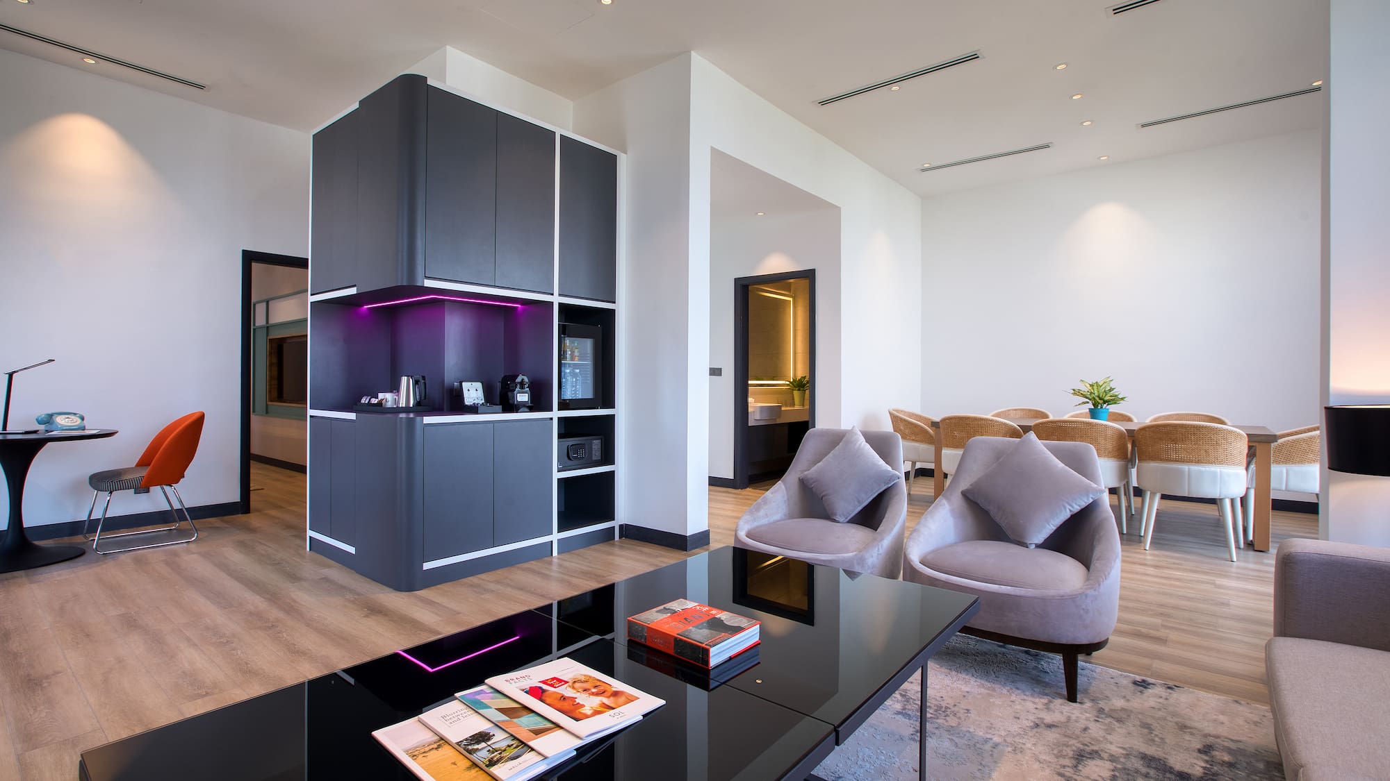 a room with a black table and chairs