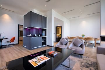 a room with a black table and chairs