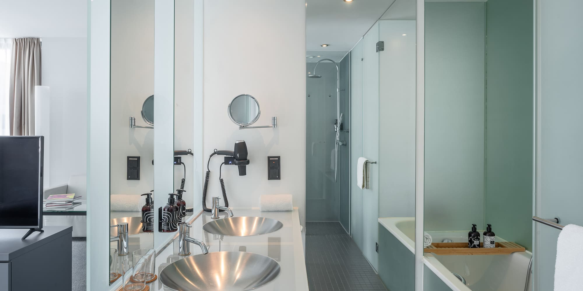 a bathroom with a shower and sink