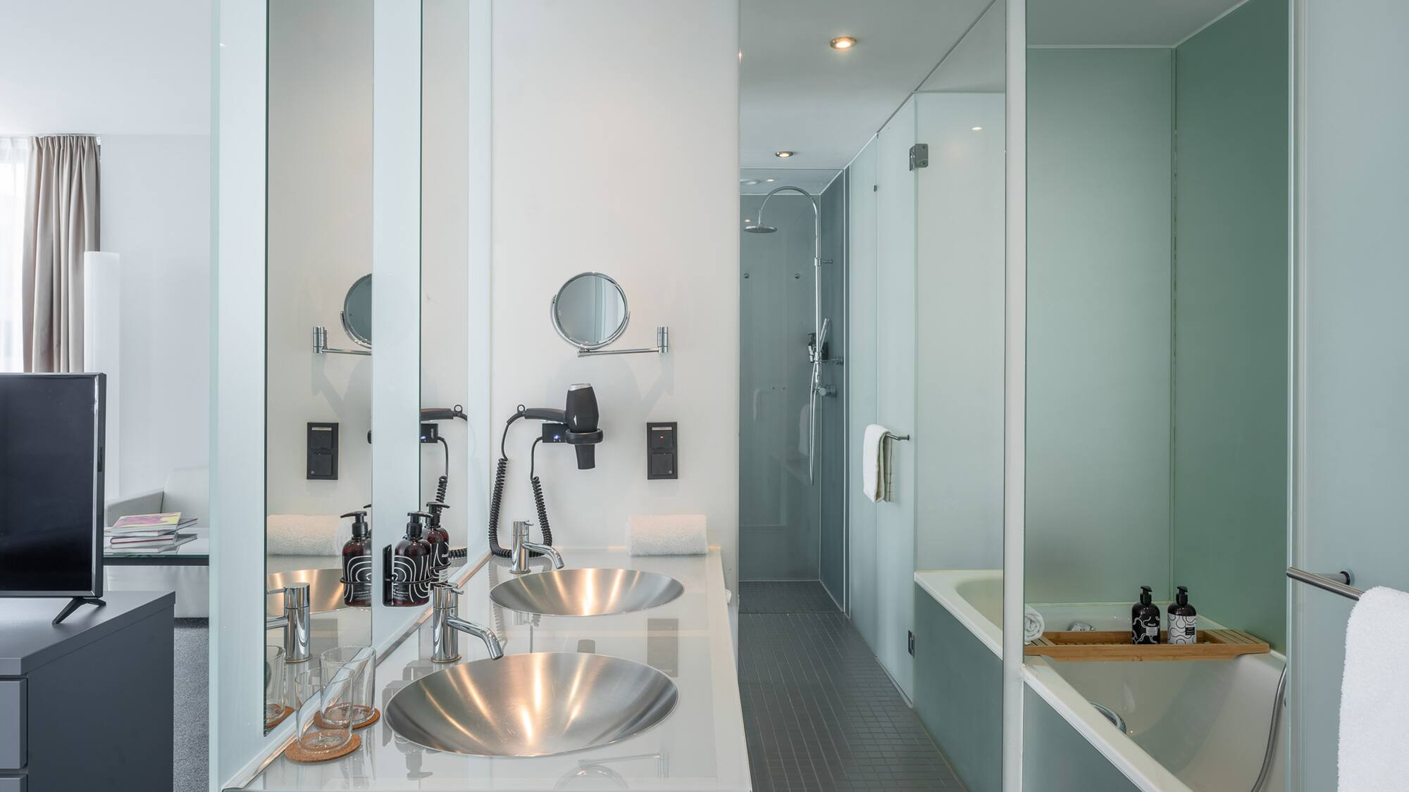 a bathroom with a shower and sink