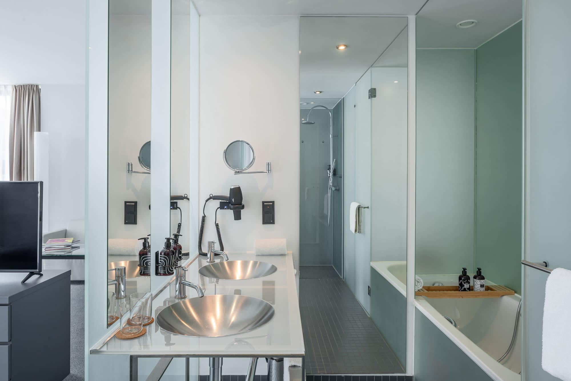 a bathroom with a shower and sink