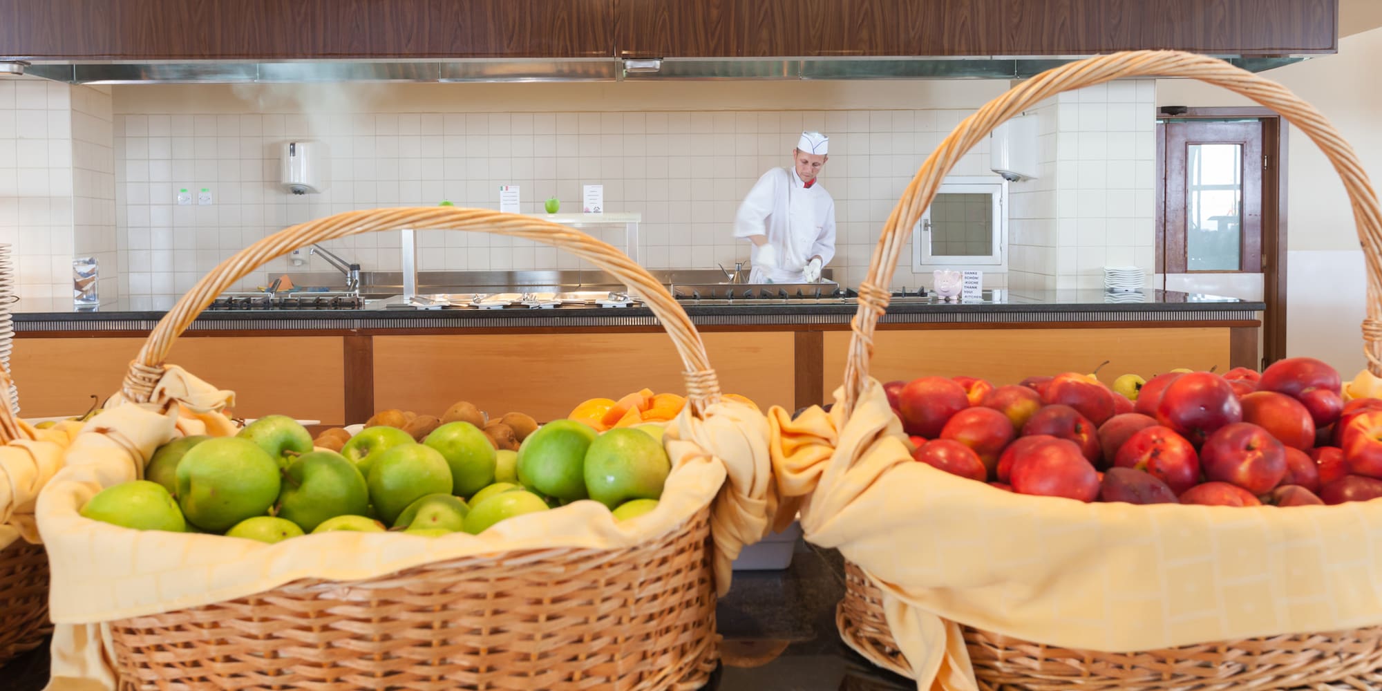 baskets of fruit in baskets in a kitchen