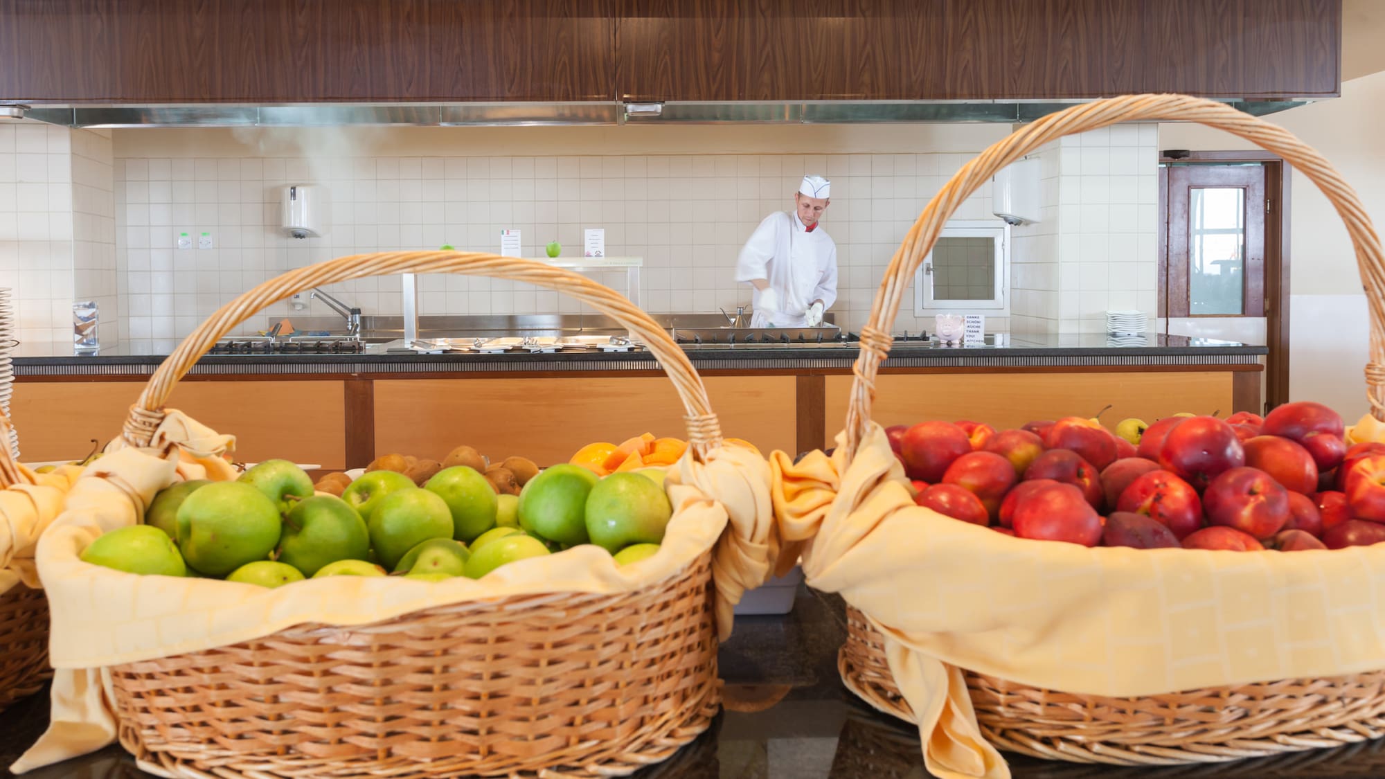 baskets of fruit in baskets in a kitchen