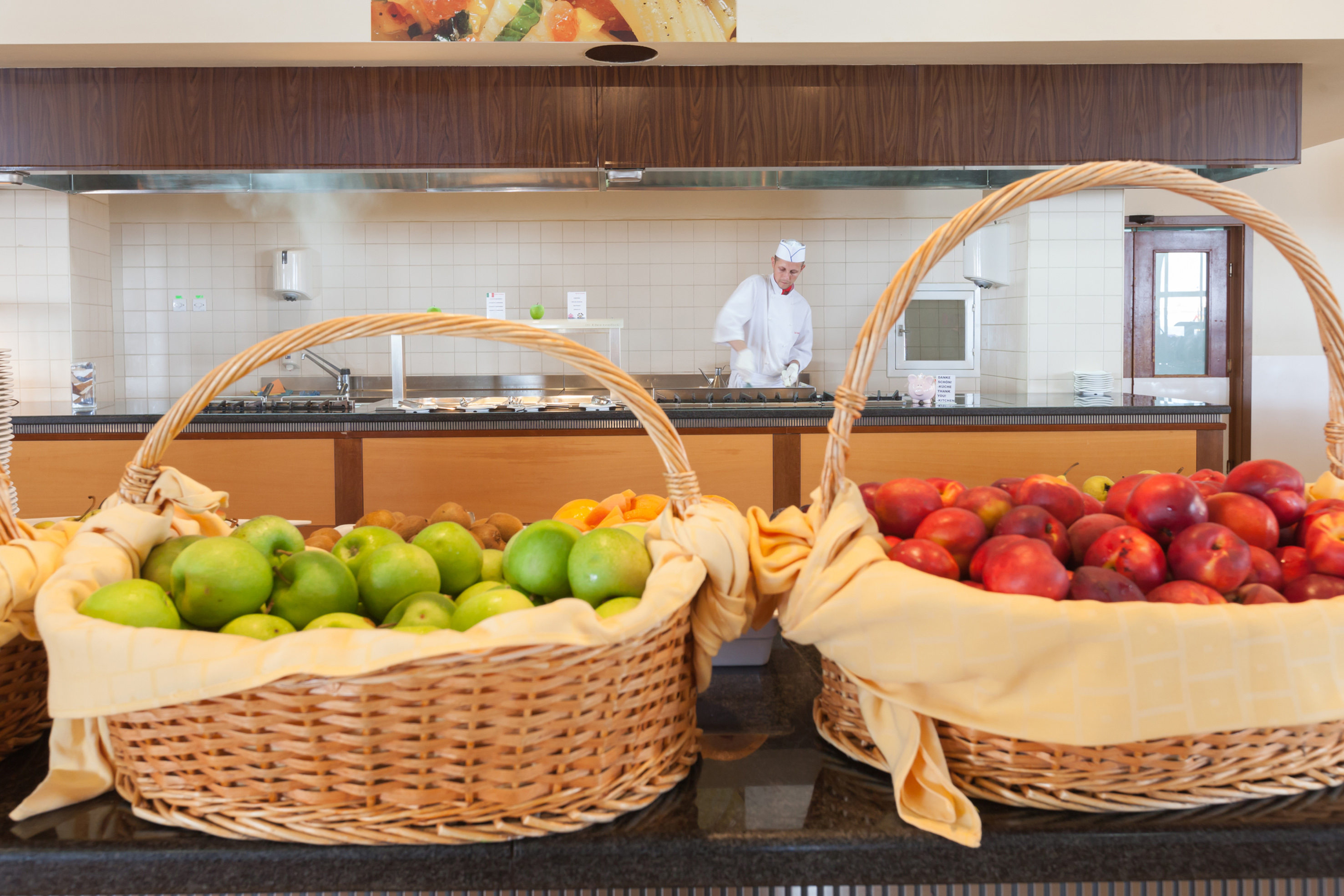 baskets of fruit in baskets in a kitchen
