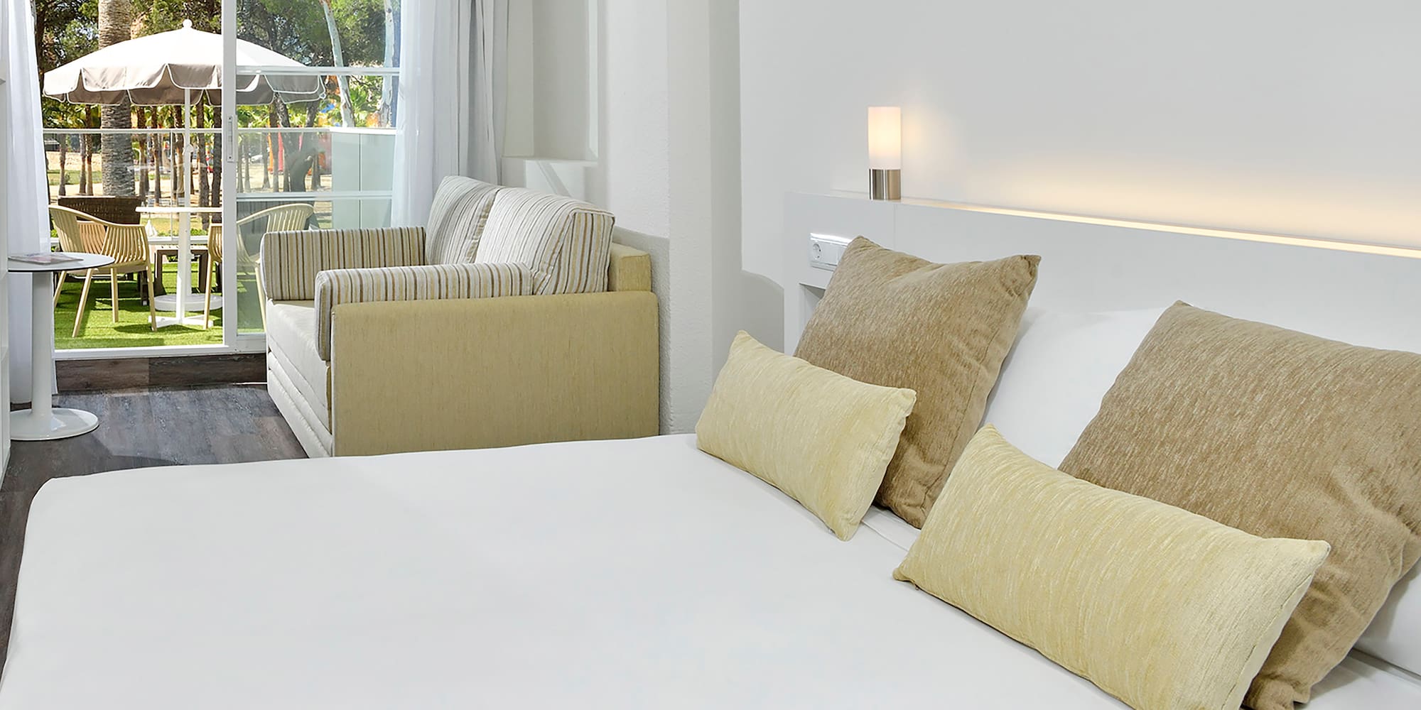 a bed with pillows in a room