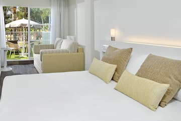 a bed with pillows in a room