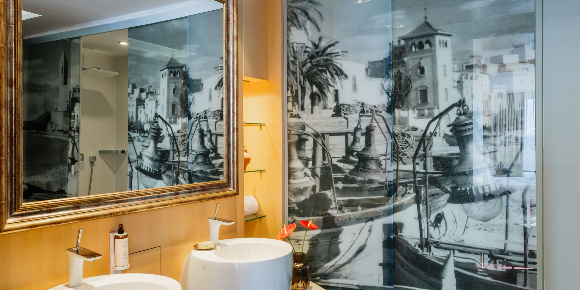 a bathroom with a mirror and a picture of a boat