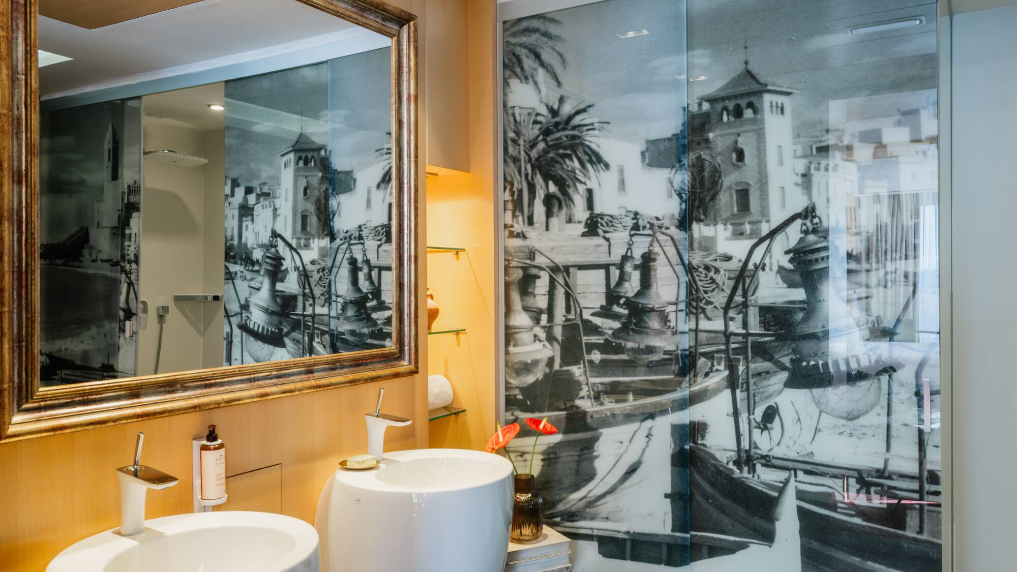 a bathroom with a mirror and a picture of a boat