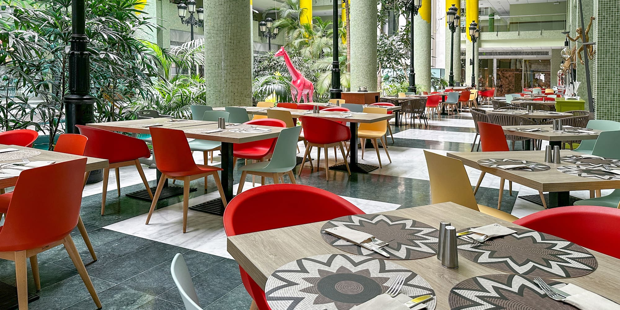 a restaurant with tables and chairs