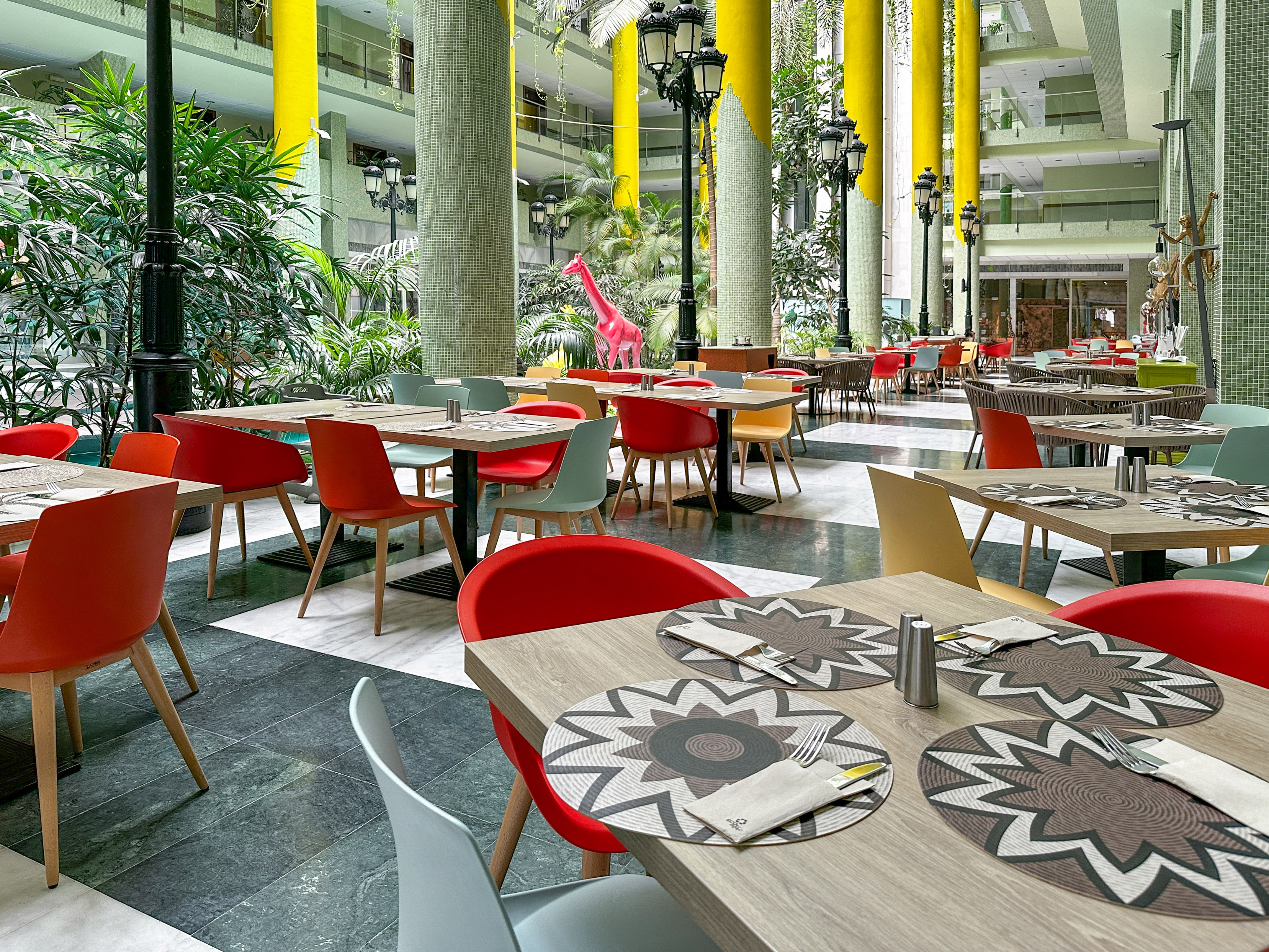 a restaurant with tables and chairs
