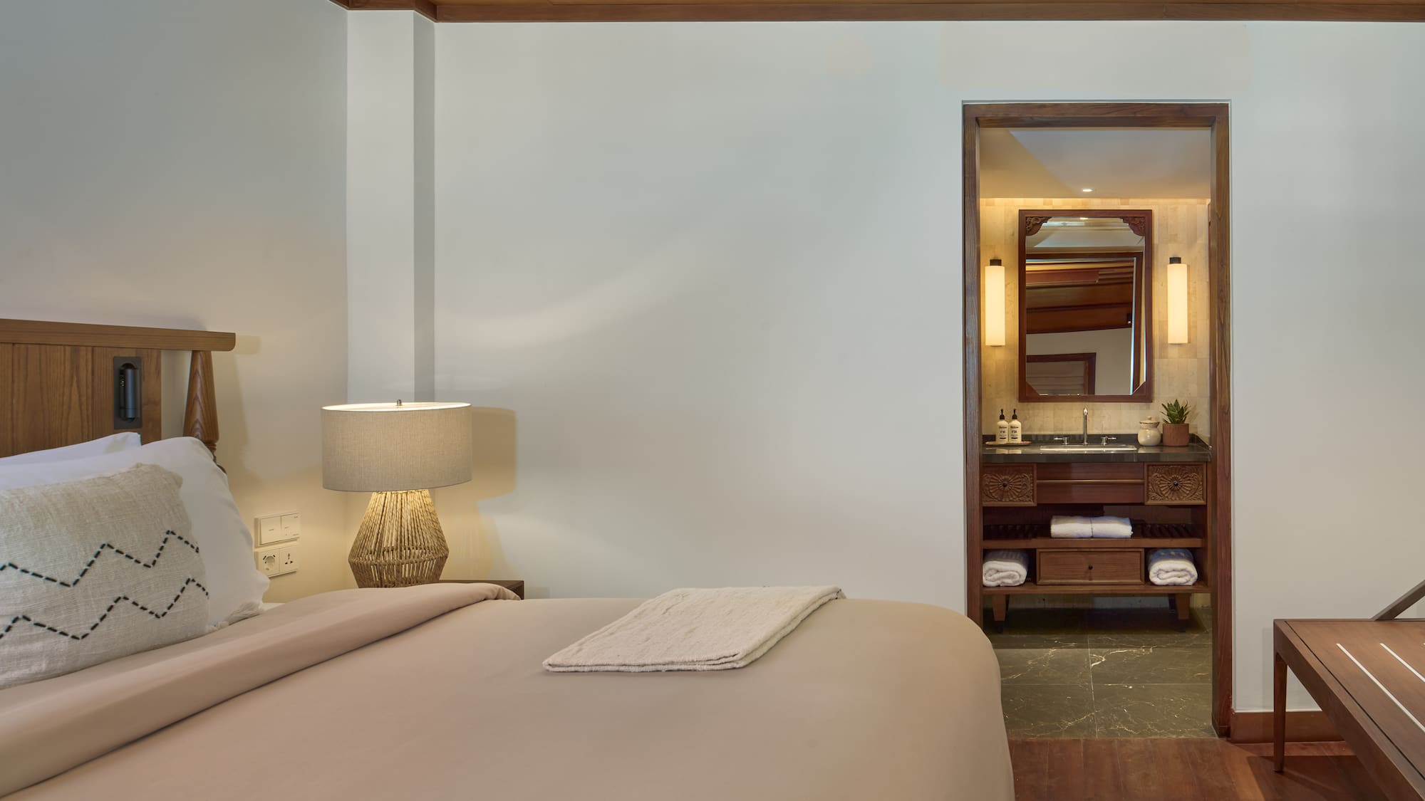 a bedroom with a bed and a mirror