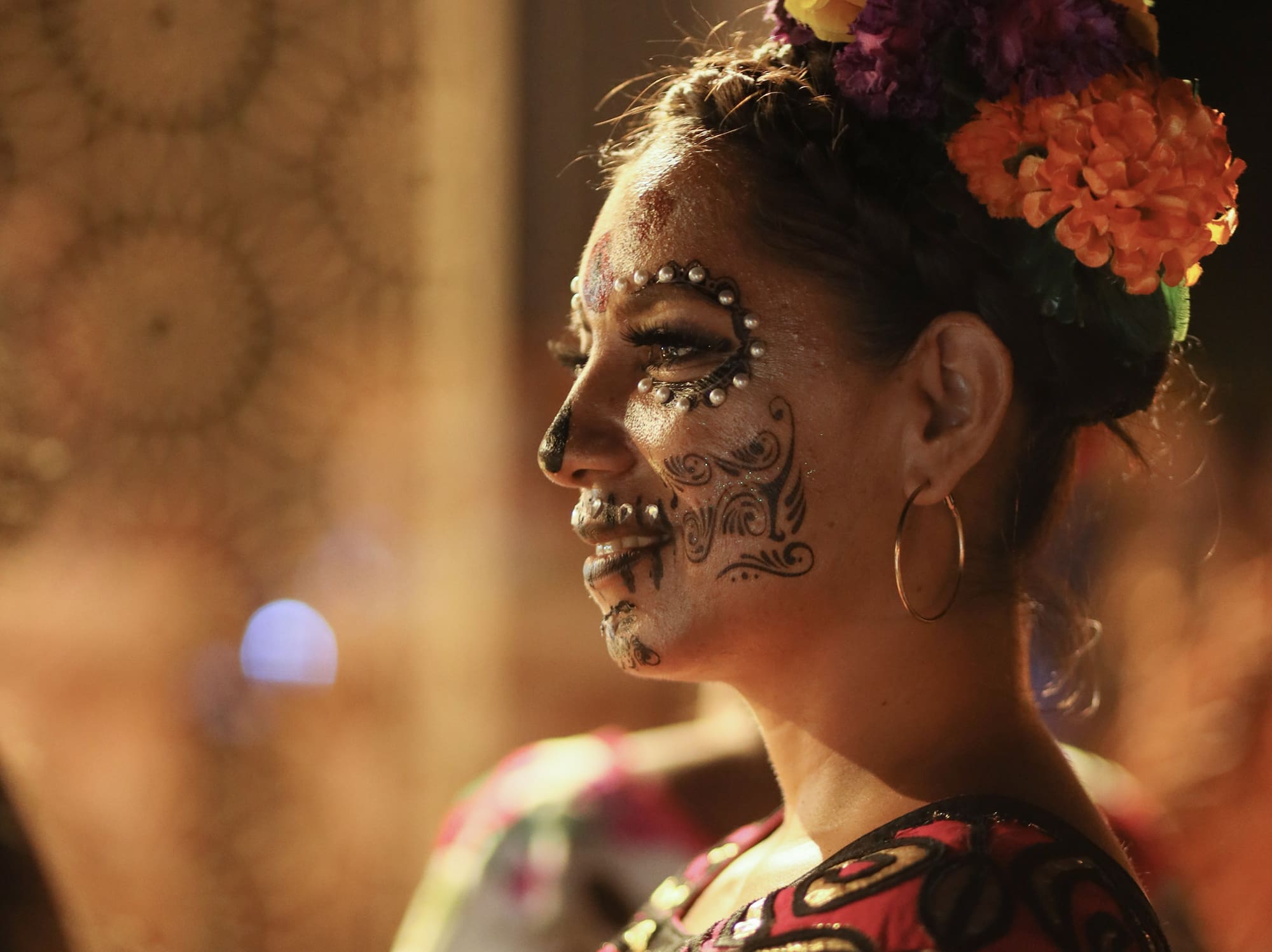 a woman with flowers on her face