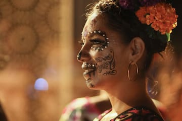 a woman with flowers on her face