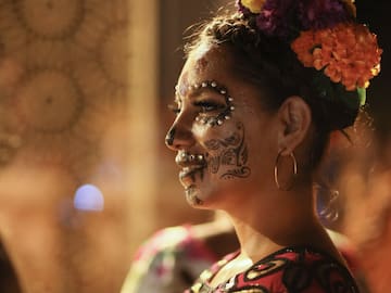 a woman with flowers on her face