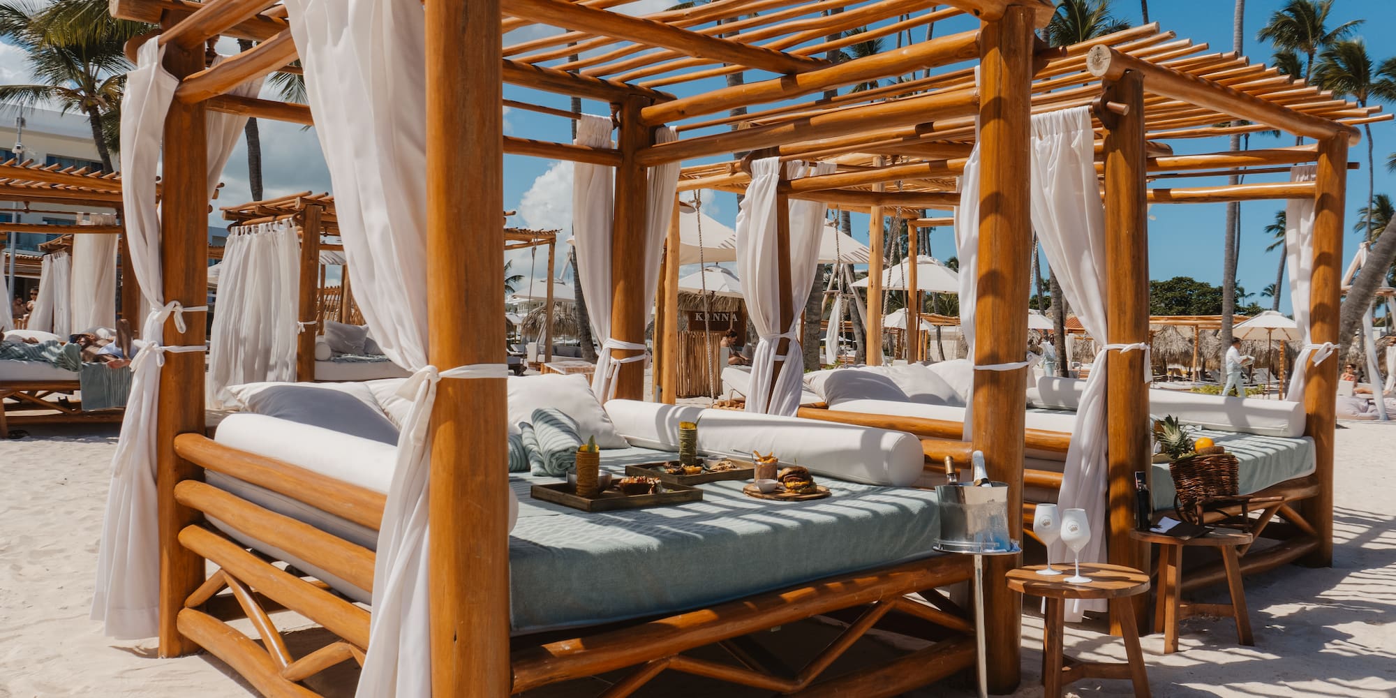 a wooden canopy on a beach