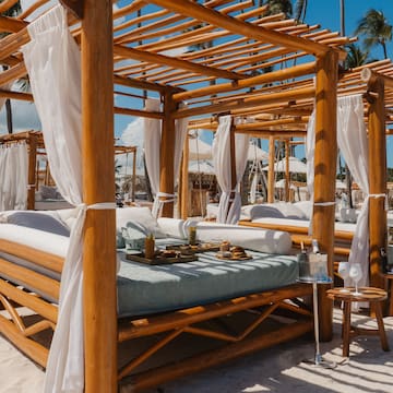 a wooden canopy on a beach
