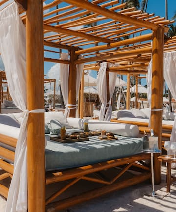a wooden canopy on a beach