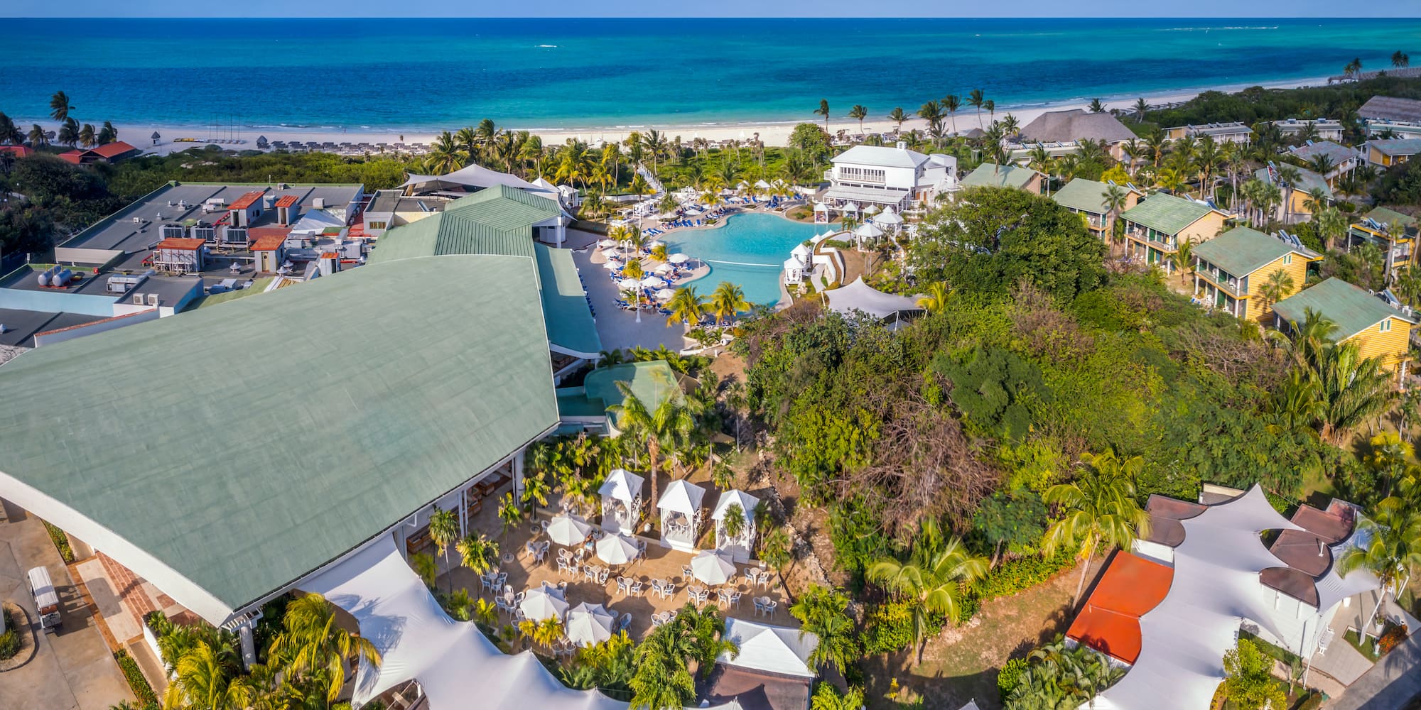 a resort with a pool and trees
