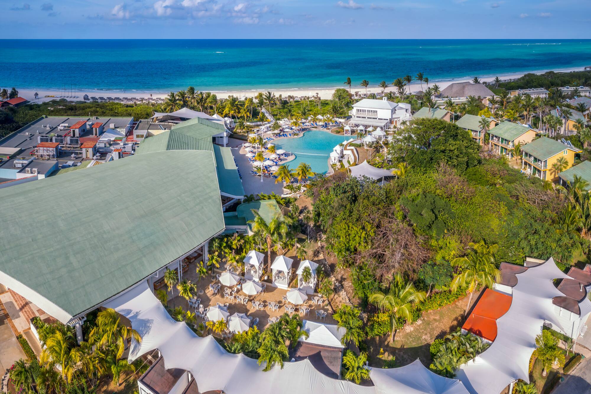 a resort with a pool and trees