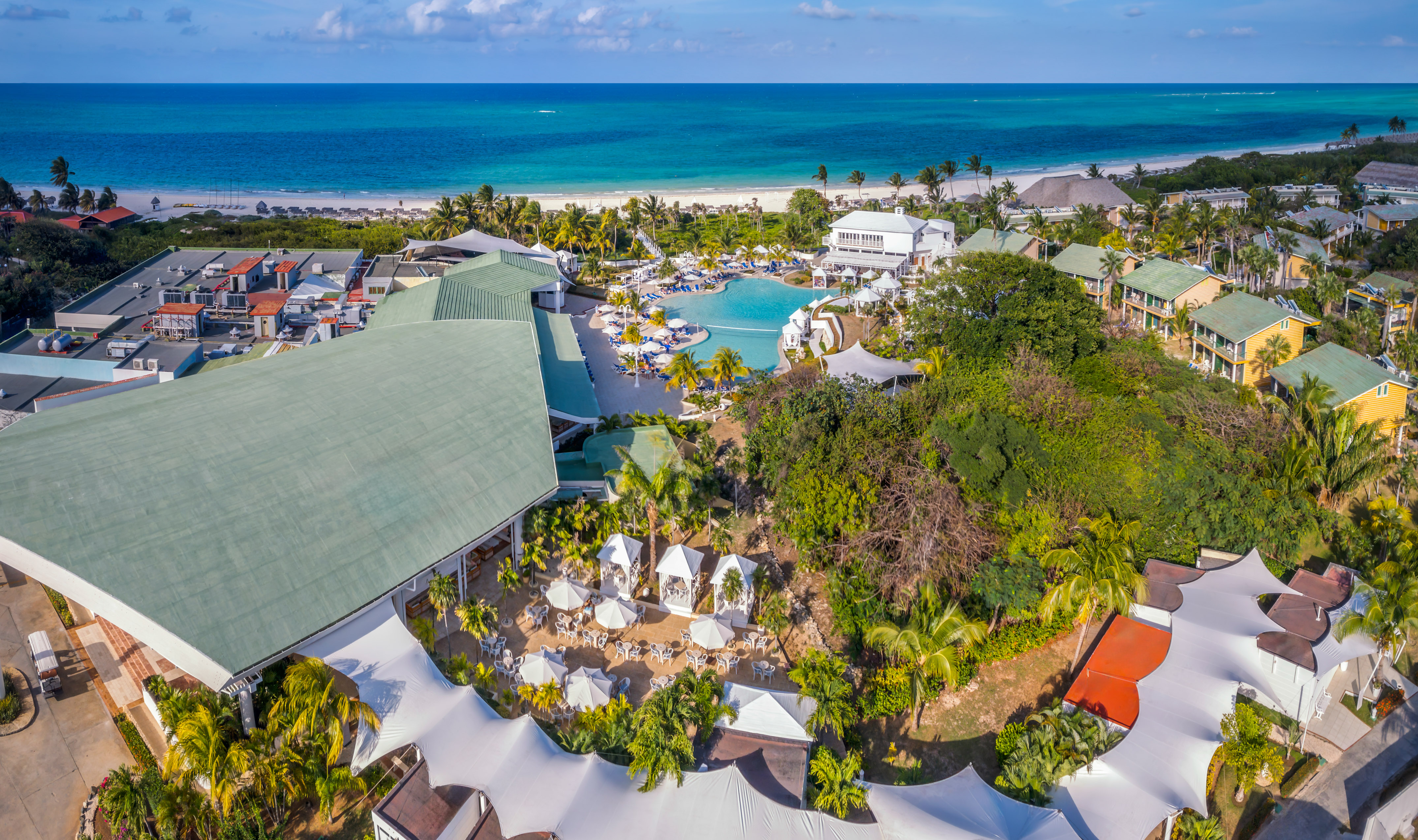 a resort with a pool and trees
