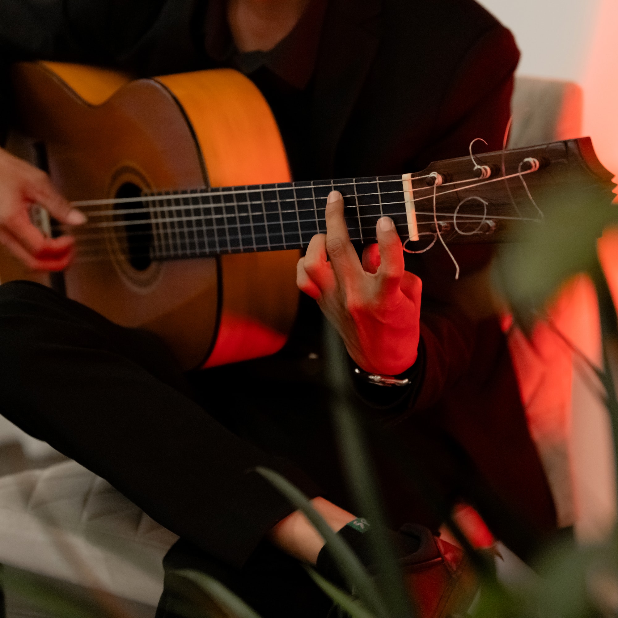 a person playing a guitar