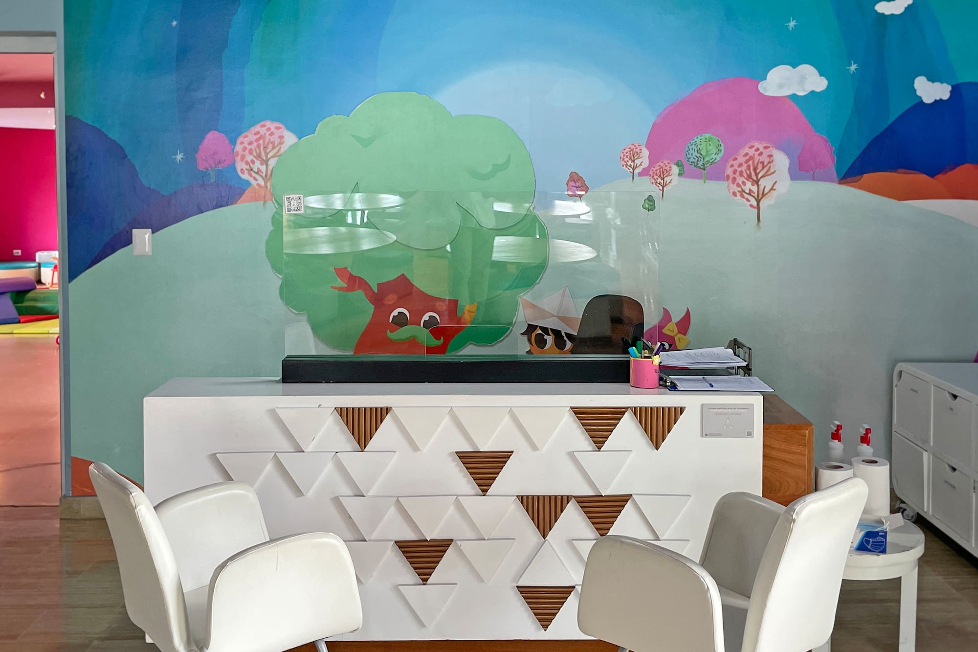 a room with a colorful wall mural