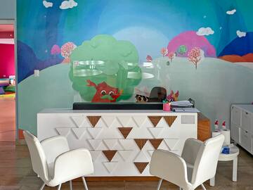 a room with a colorful wall mural