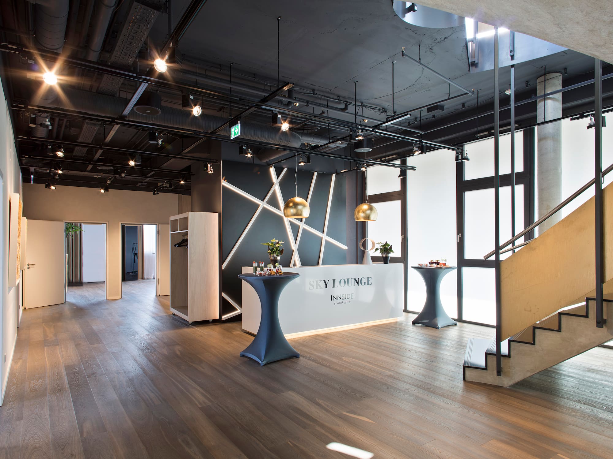 a room with a staircase and a table