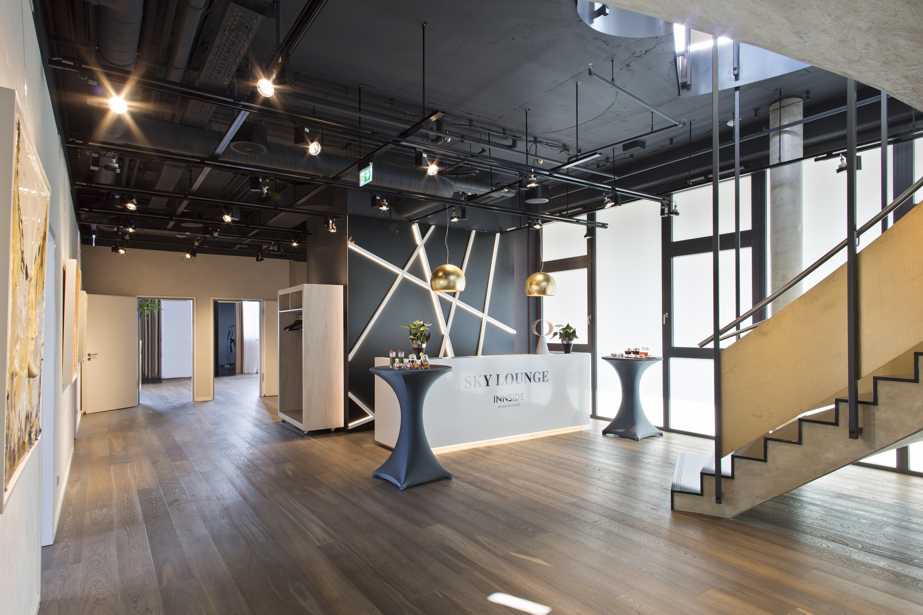 a room with a staircase and a table