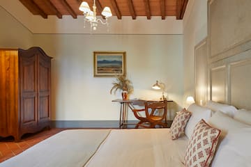 a bedroom with a bed and desk