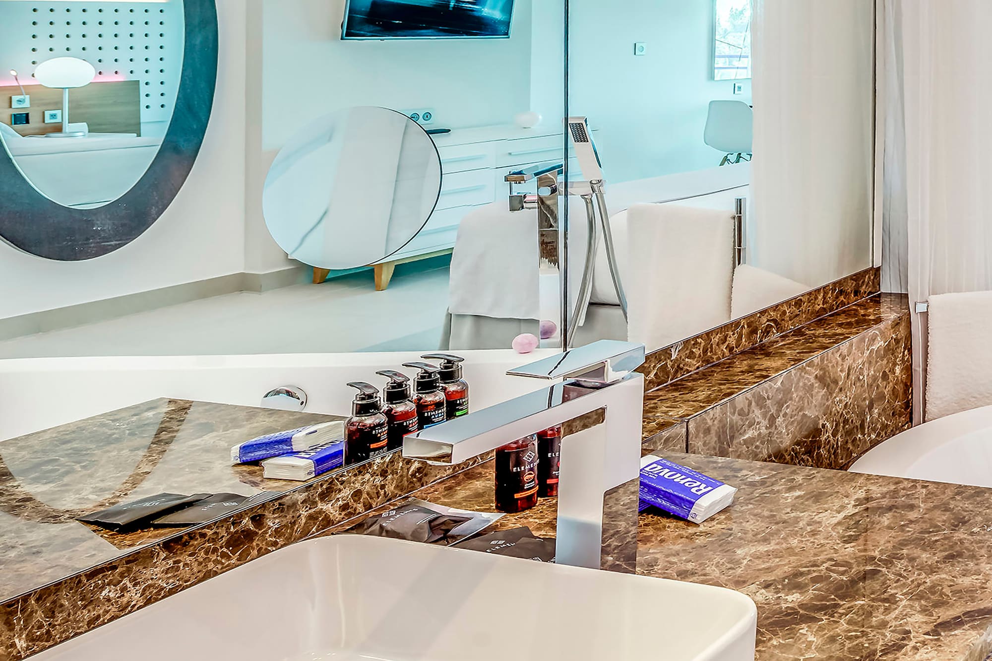 a bathroom with a sink and a mirror