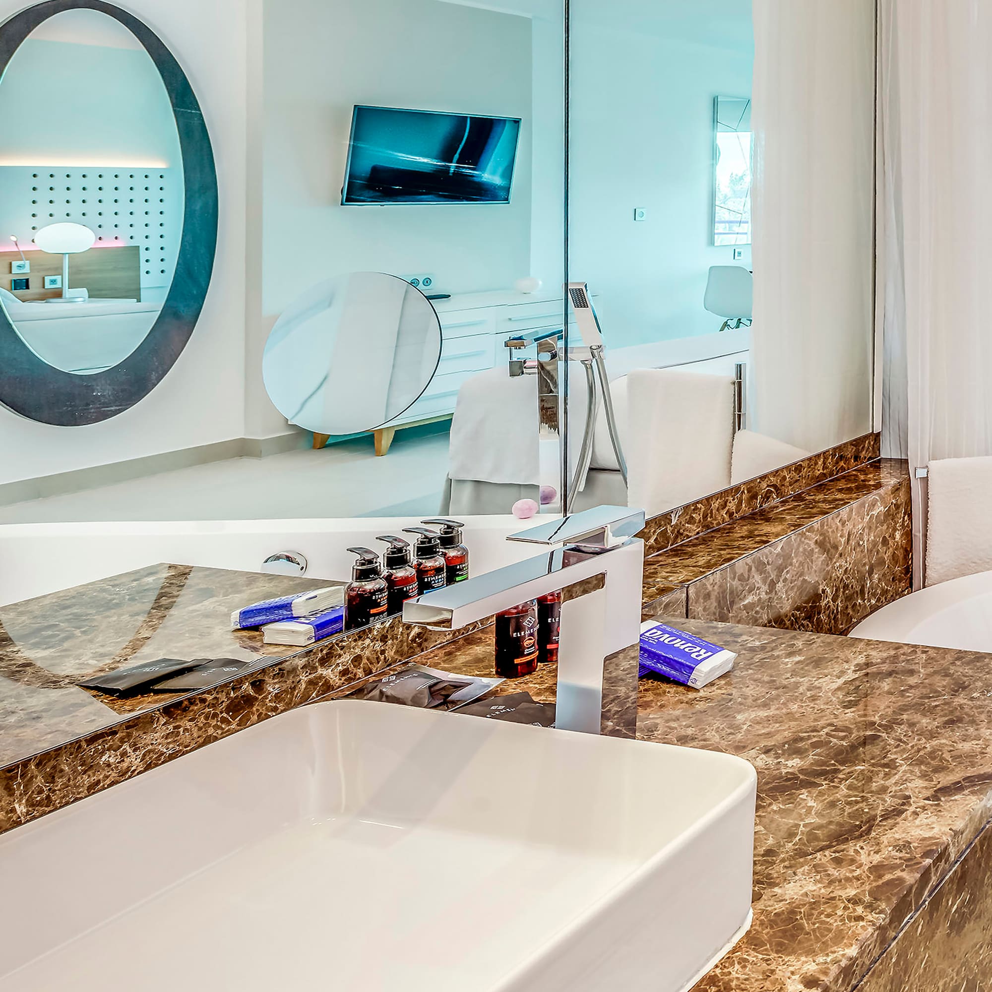 a bathroom with a sink and a mirror